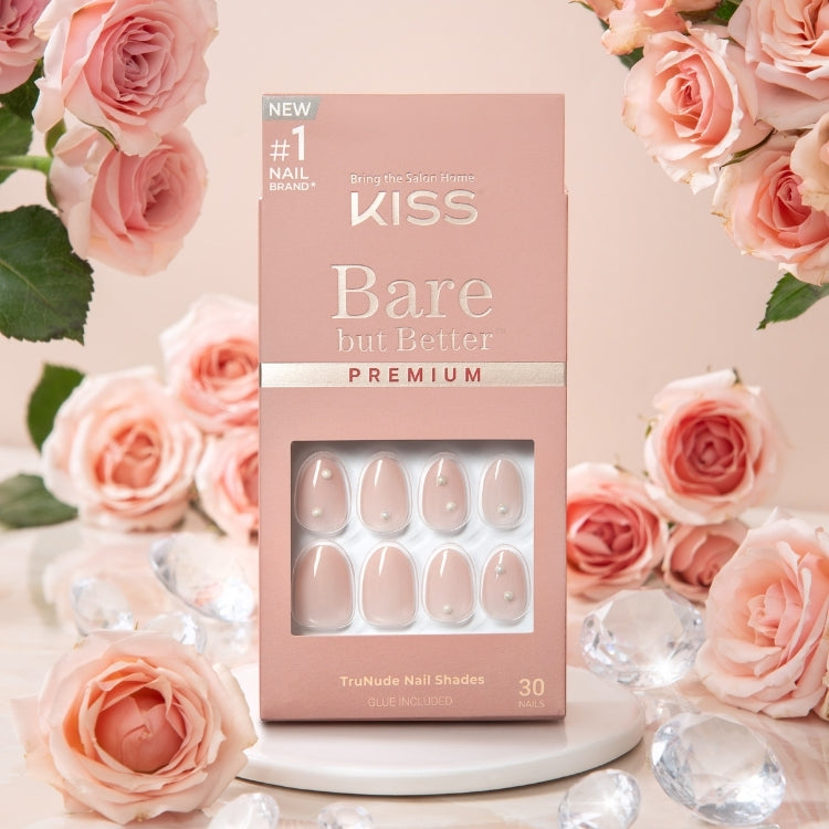Bare But Better - Premium Nails - Slay, nude nagels in een elegante verpakking, omringd door rozen en kristallen.