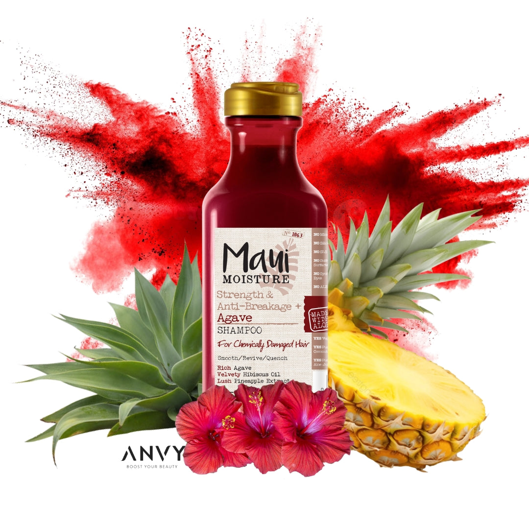 Strength & Anti-Breakage + Agave Shampoo in een rode fles met een gouden dop, omringd door ananas en bloemen.