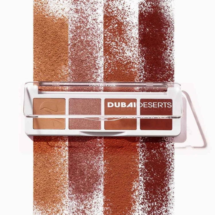 Mini Eyeshadow Palette Dubai Deserts met warme aardetinten in een compacte, doorzichtige verpakking.